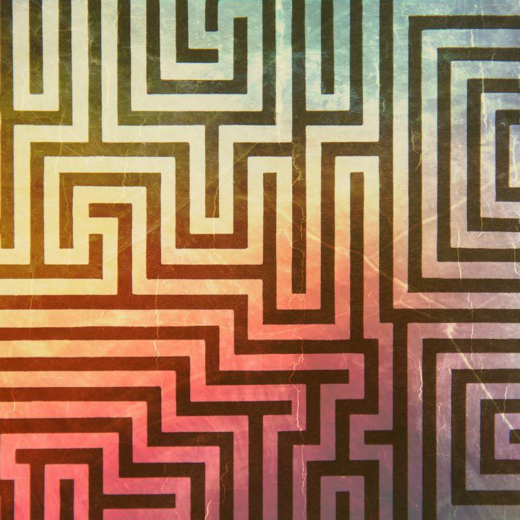 A colorful abstract background with a maze in the center